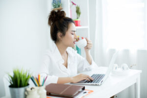 A cup of hot tea on a table with a calm background, creating a relaxing atmosphere perfect for relieving work stress.