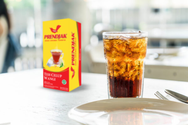 A glass of cold sweet iced tea, a refreshing drink to quench thirst in hot weather
